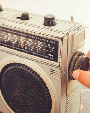 woman-s-hand-adjusting-button-vintage-radio_1484-1362-626x375